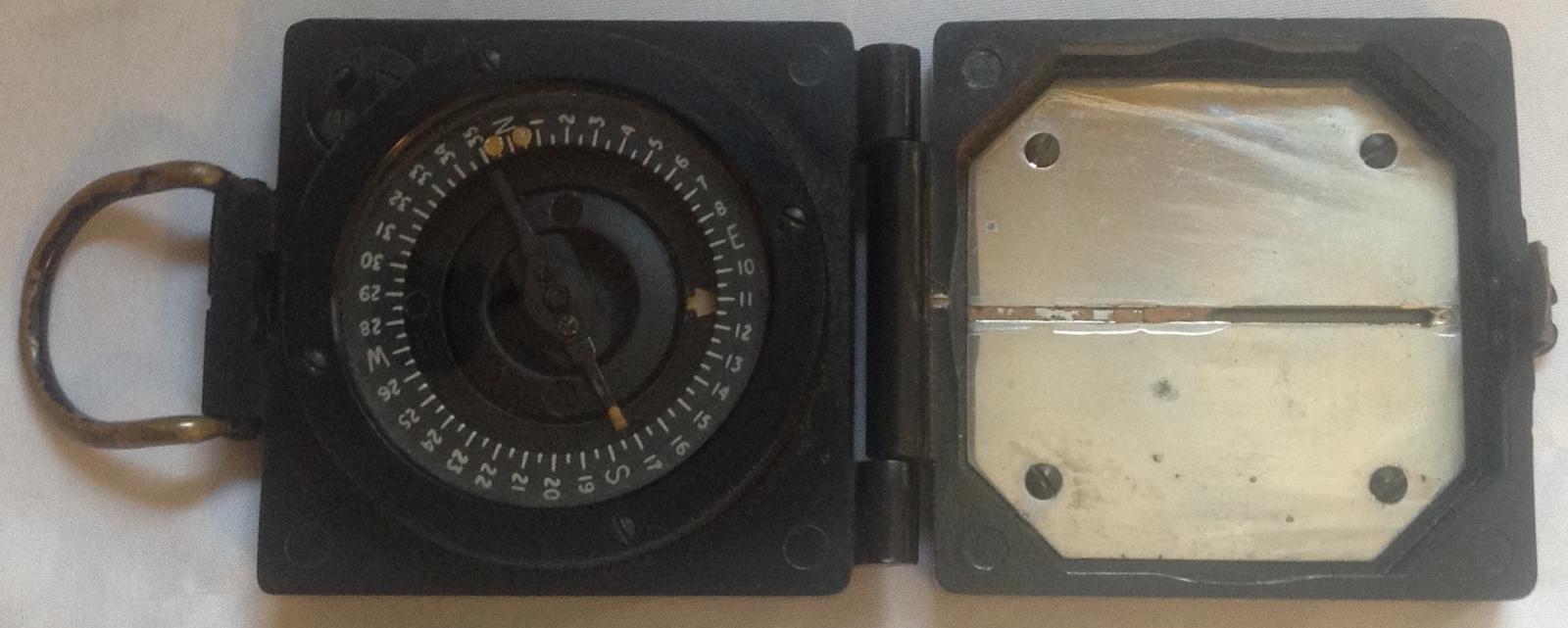 Compas showing dial and mirror