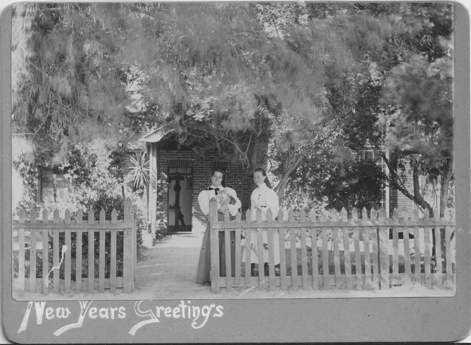 Carlotta & Virginia Prinsep in front of the The Studio c1895 where the lead light window is assumed to be installed in the door surrounds.