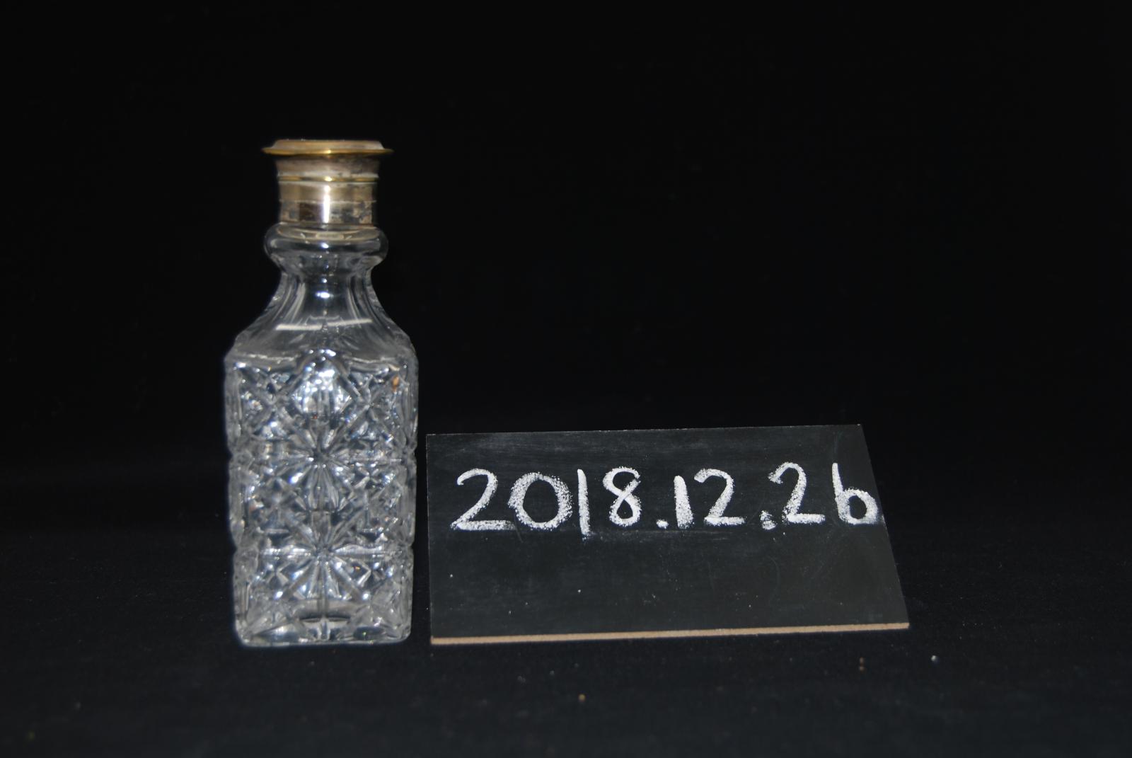 One of the glass bottles with metal shaker lid