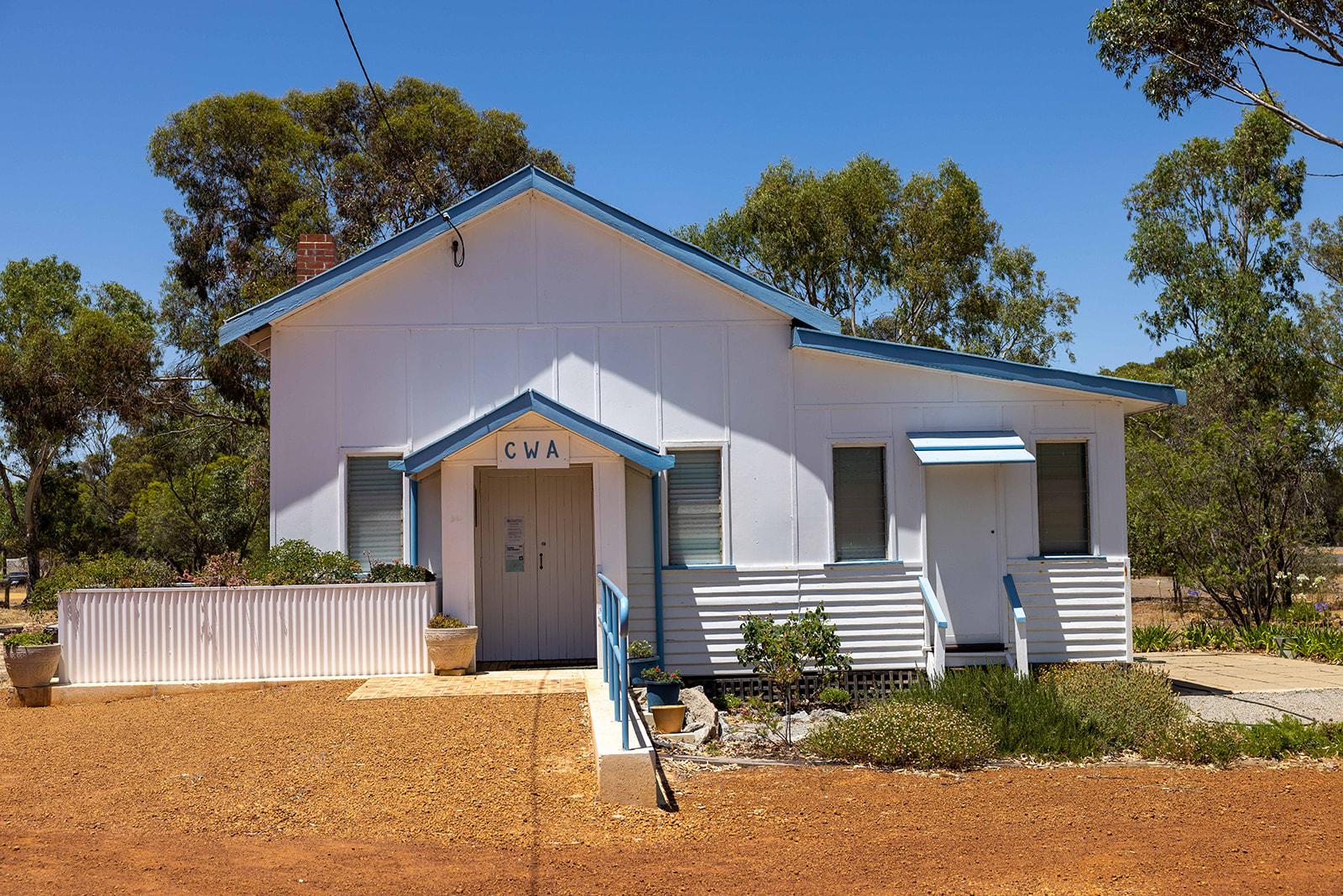 white building with 'CWA' sign over front door