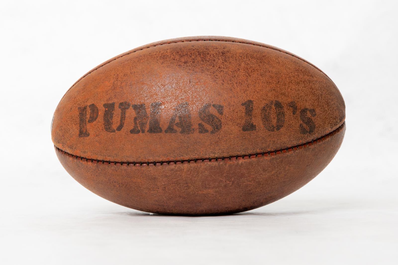 A brown leather 'Burley' Australian Rules football, all markings are very faded. 