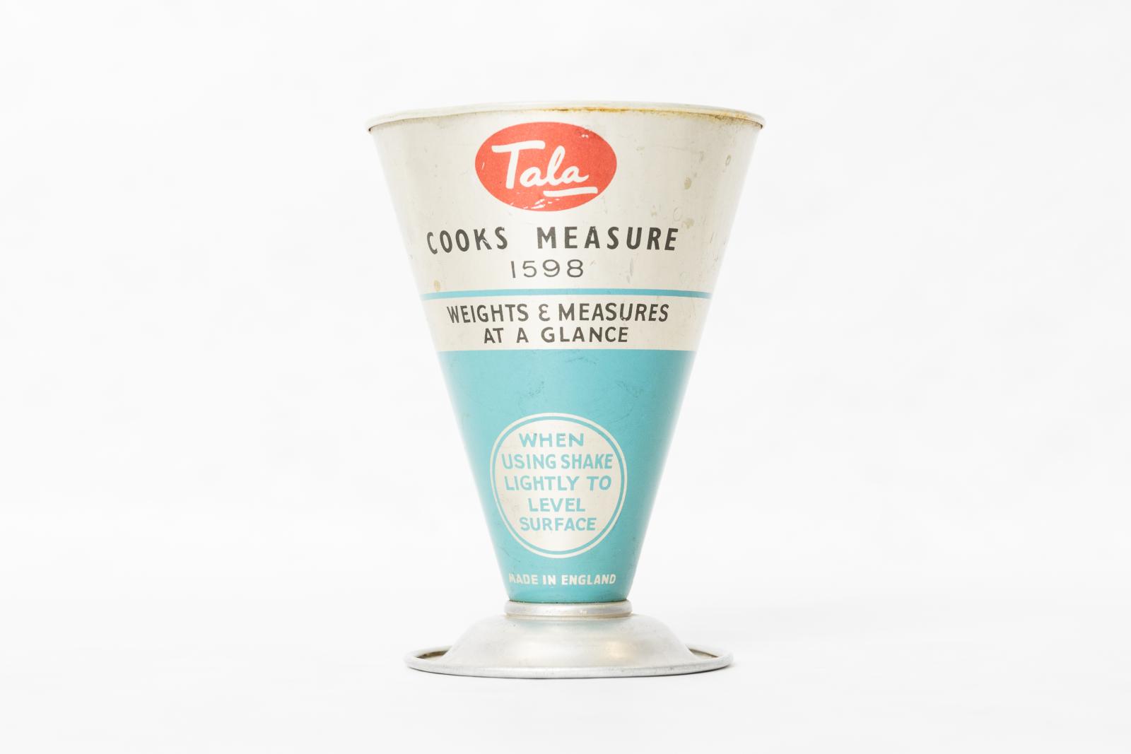 A white and Blue cone shaped measuring cup with a flat base. 