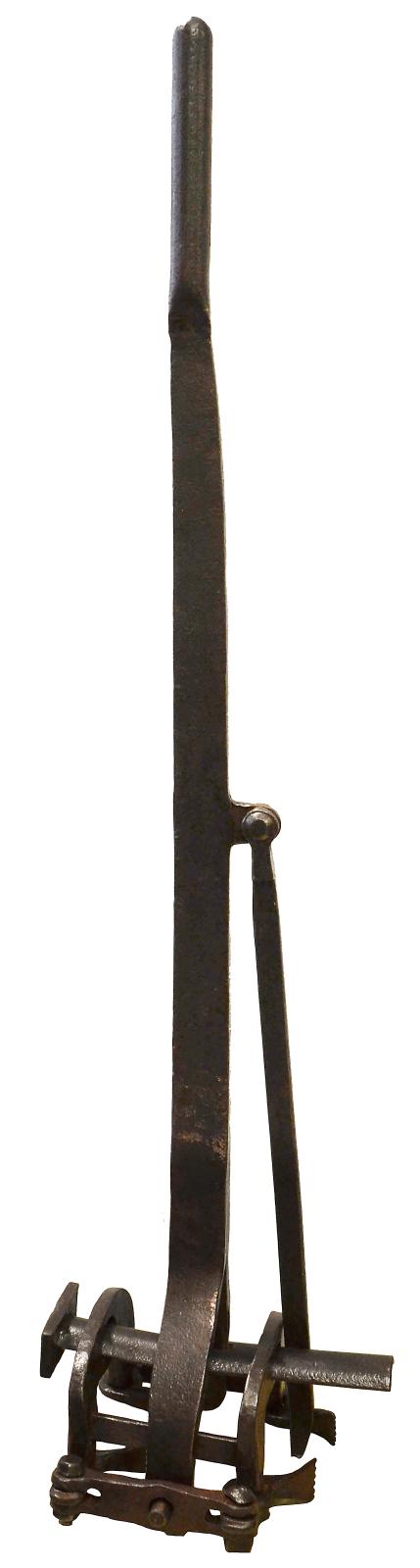 A long metal handle attached to a square shaped metal clamp. On the back of the handle half way up is a metal rod attached by a pin that can swing out.