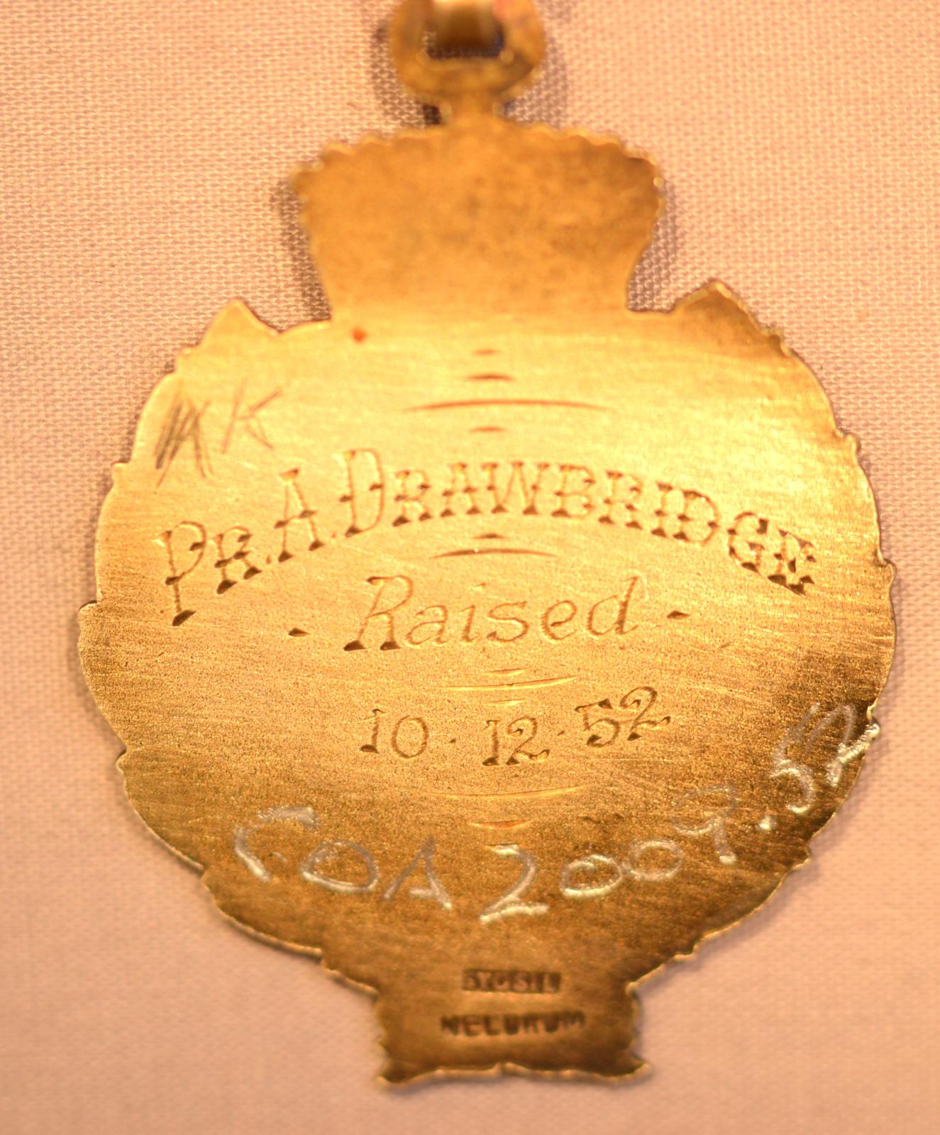 Rear of medal showing name of awardee and date awarded