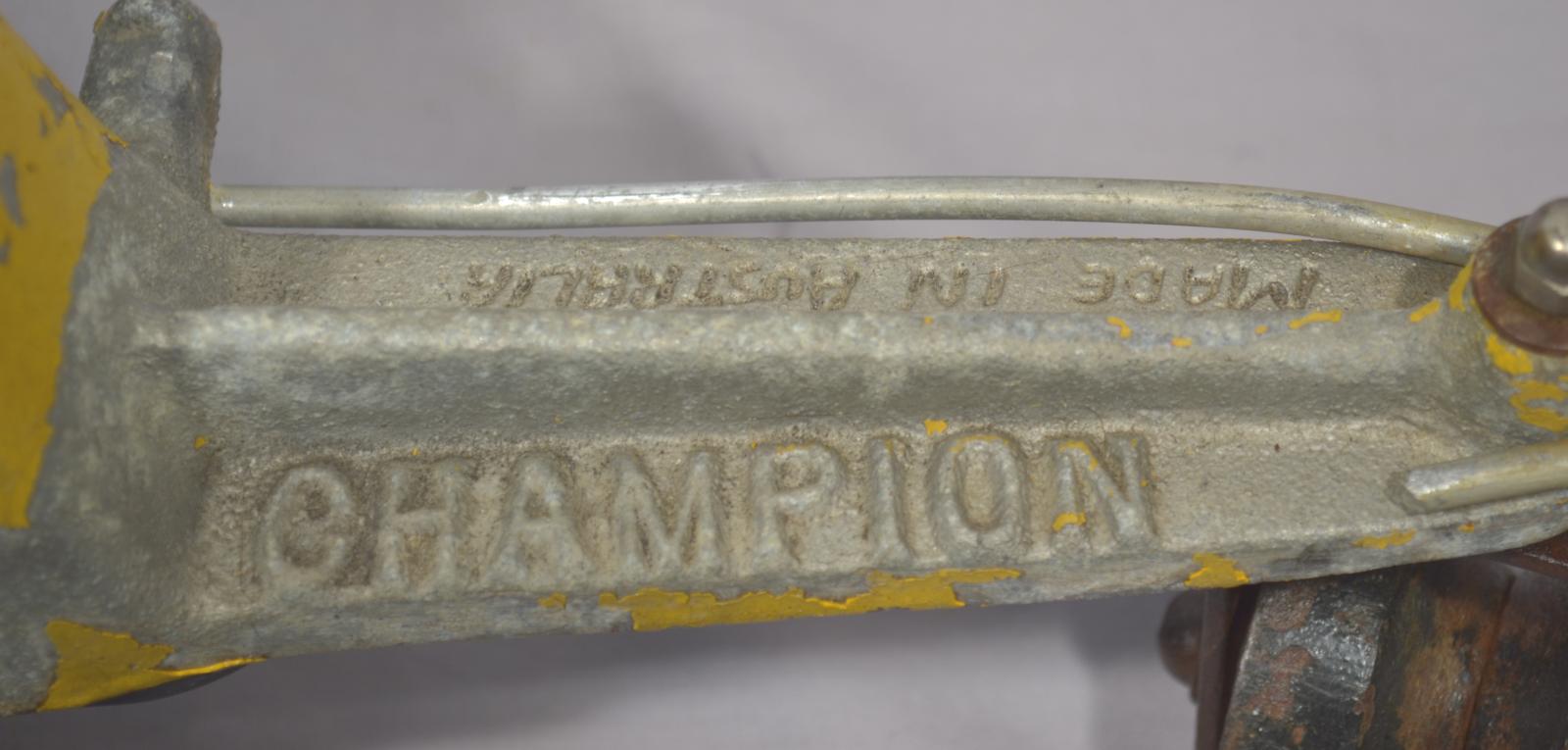 Text on front of tractor sprikler 'CHAMPION MADE IN AUSTRALIA'