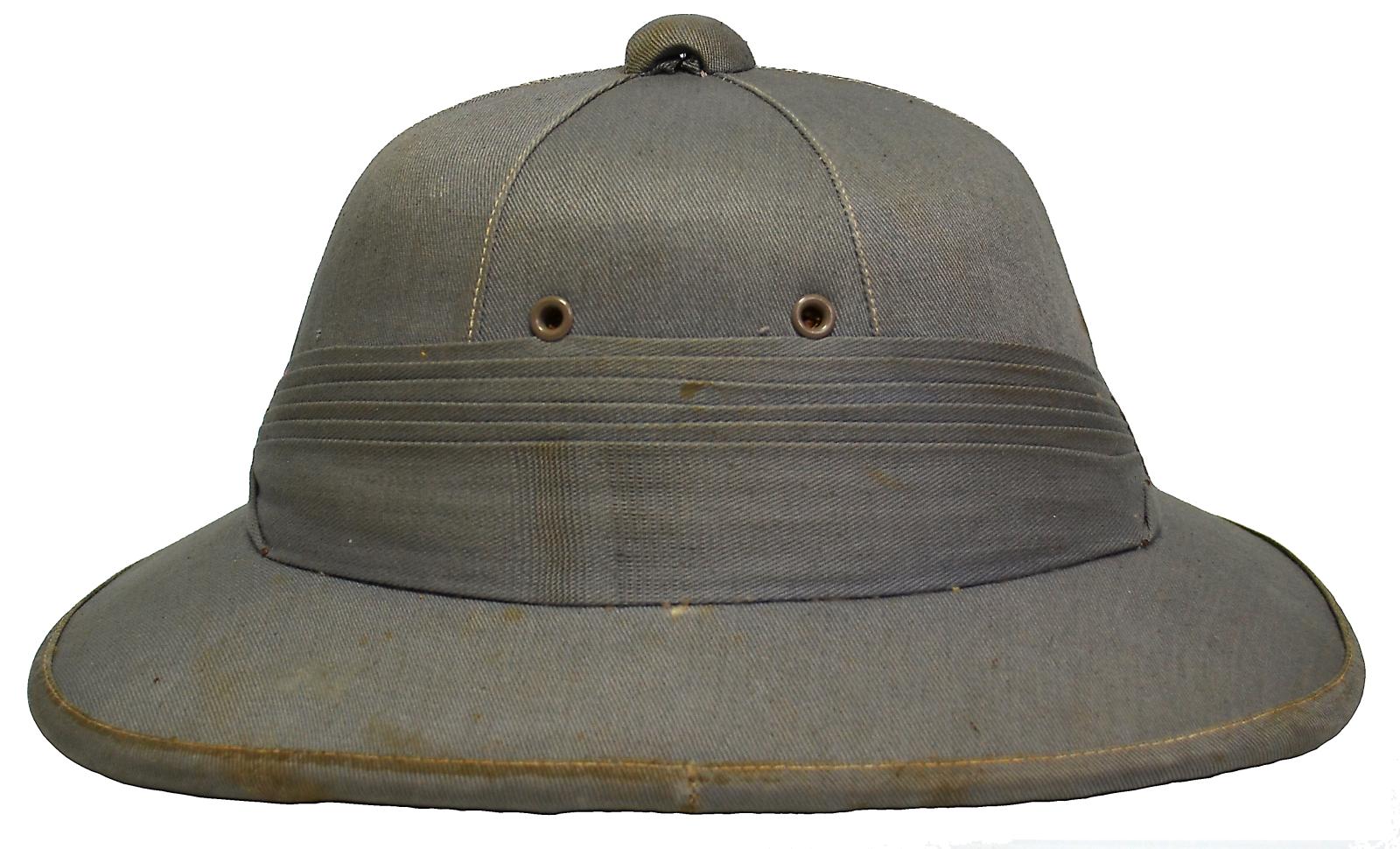 Front of pith helmet is a dome shape with stiff broad brim around the edge. Grey cloth is sewn over the helmet and top of the brim. A grey button is on top of the helmet and a strip of grey cloth is wrapped 6 times around the middle of the helmet above the brim and sewn in place