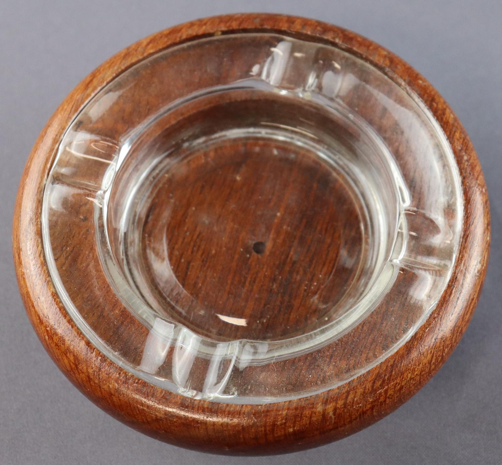 Round jarrah ashtray with a glass insert for holding ash and resting cigarettes 