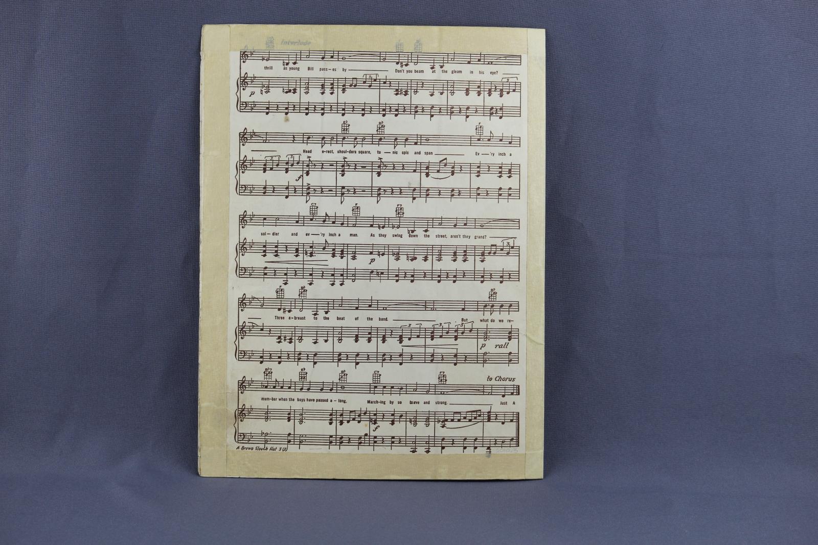 Back page of the sheet music for the song "A Brown Slouch Hat". This is the third page of the musical score and words for the song. The card is a white colour and printing is black. Masking tape has been used on the edges of the page.