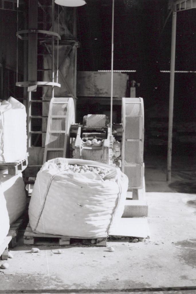 black and white photo of machinery at a factory