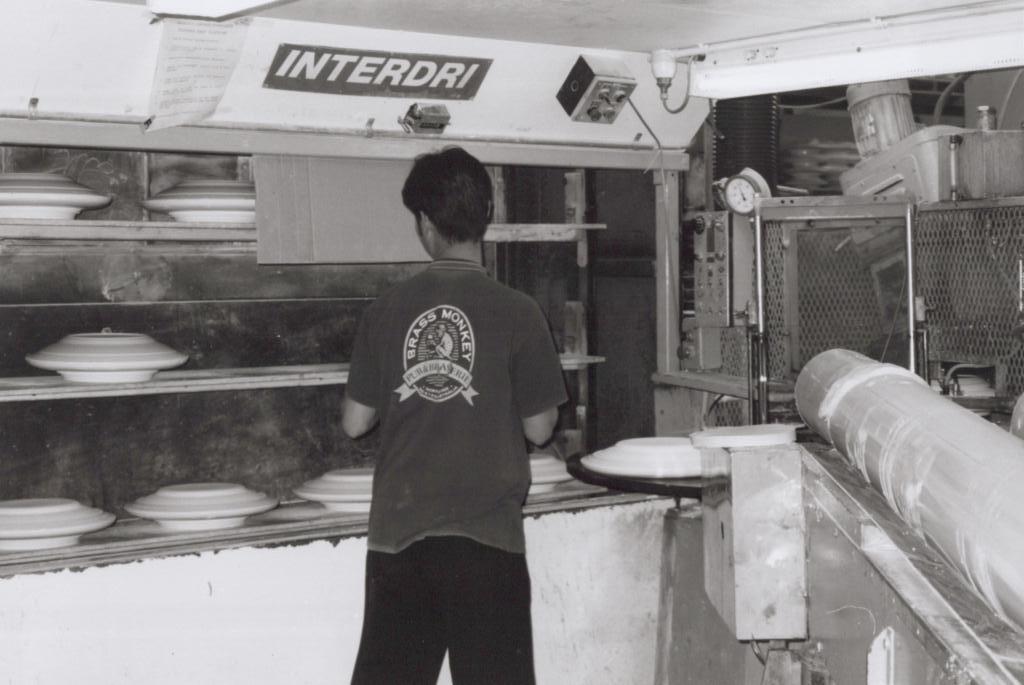 photograph of person using a moulding machine