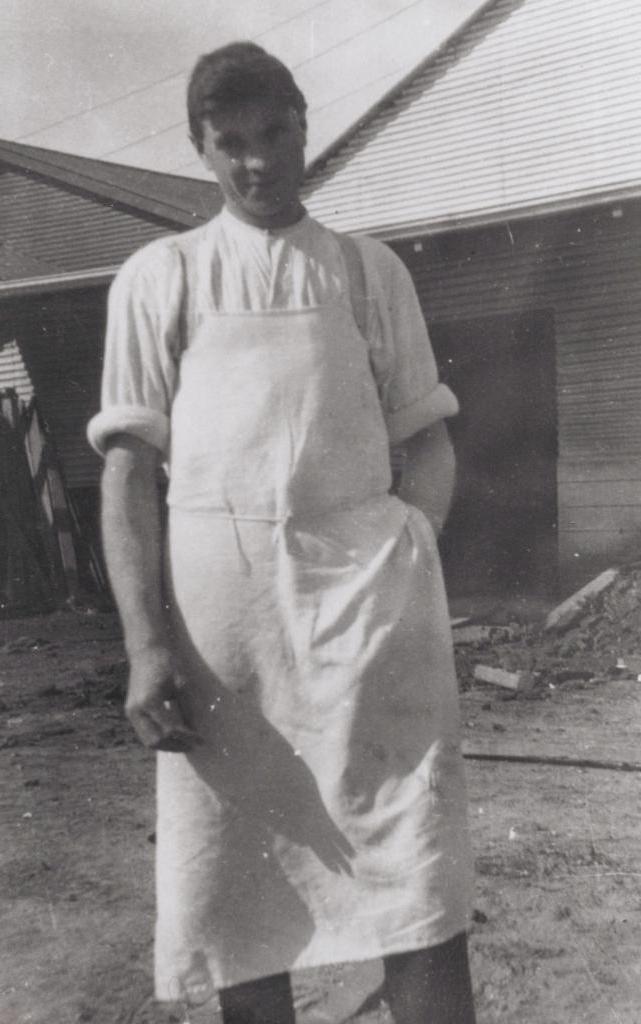 man with white apron