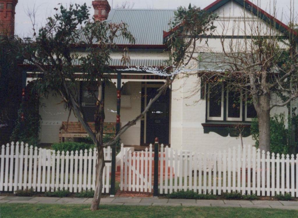 house with white picket fence