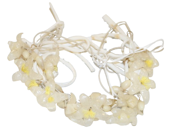 A cream and yellow floral arc shaped headdress. The headdress is made of a thin wire headband which is bound in white cotton. There are 10 wax flowers, 9 attached, 1 unattached. The wax flowers each have 5 pointed petals and a centre made with yellow cotton threads. There are also 20 small bud shaped wax flowers and several looped white cords at each side and a narrow double elastic band for attachment.