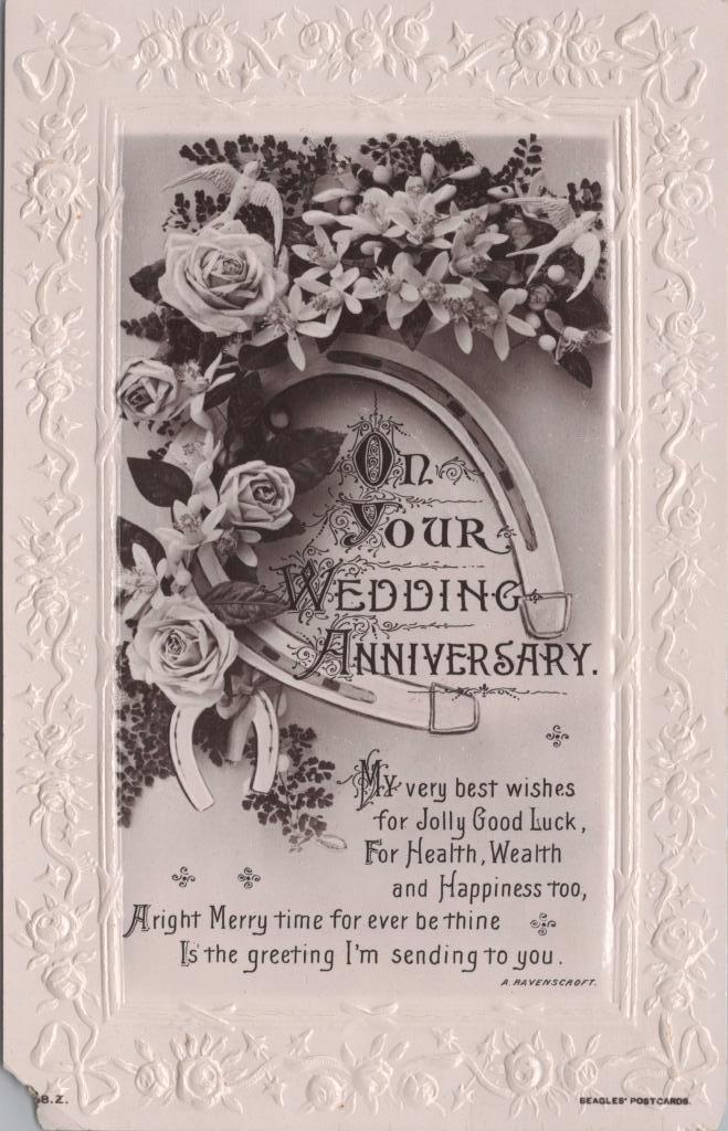 Postcard. Front: 'On Your Wedding Anniversary' with black and white image of a horseshoe and flowers. There is a poem at the bottom.