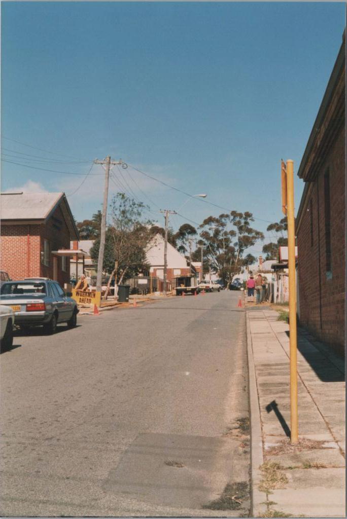 photo of street with cars and buildings