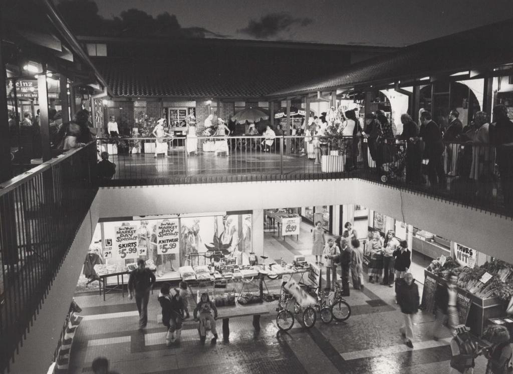 black and white photo of the inside of a multi-storied building