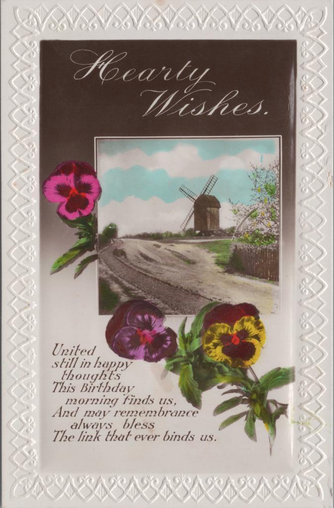 Postcard. Front: 'Hearty Wishes' with three coloured pansies. There is an image of a windmill and a poem at the bottom.