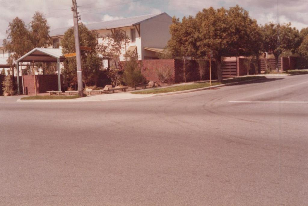 road intersection with house on corner