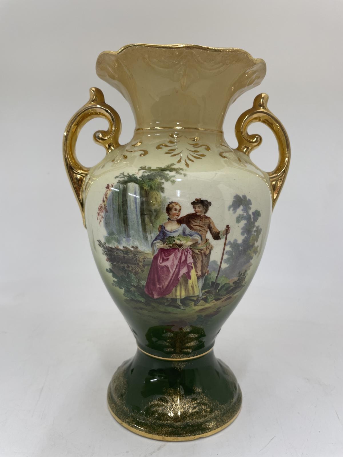 Urn Shaped vase showing picture of a couple gardening in front of a water fall