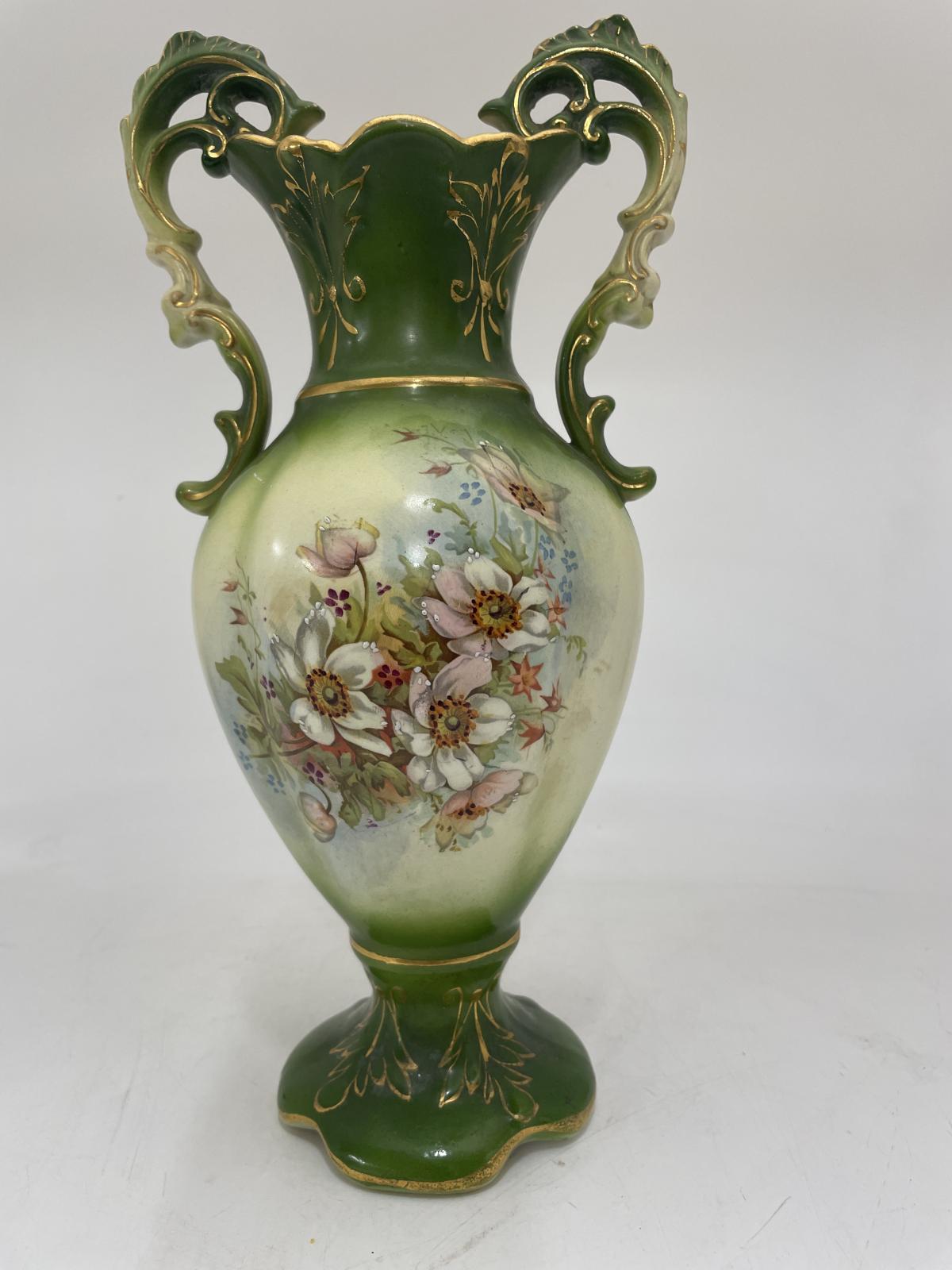 2 handled urn shaped vase with floral designs