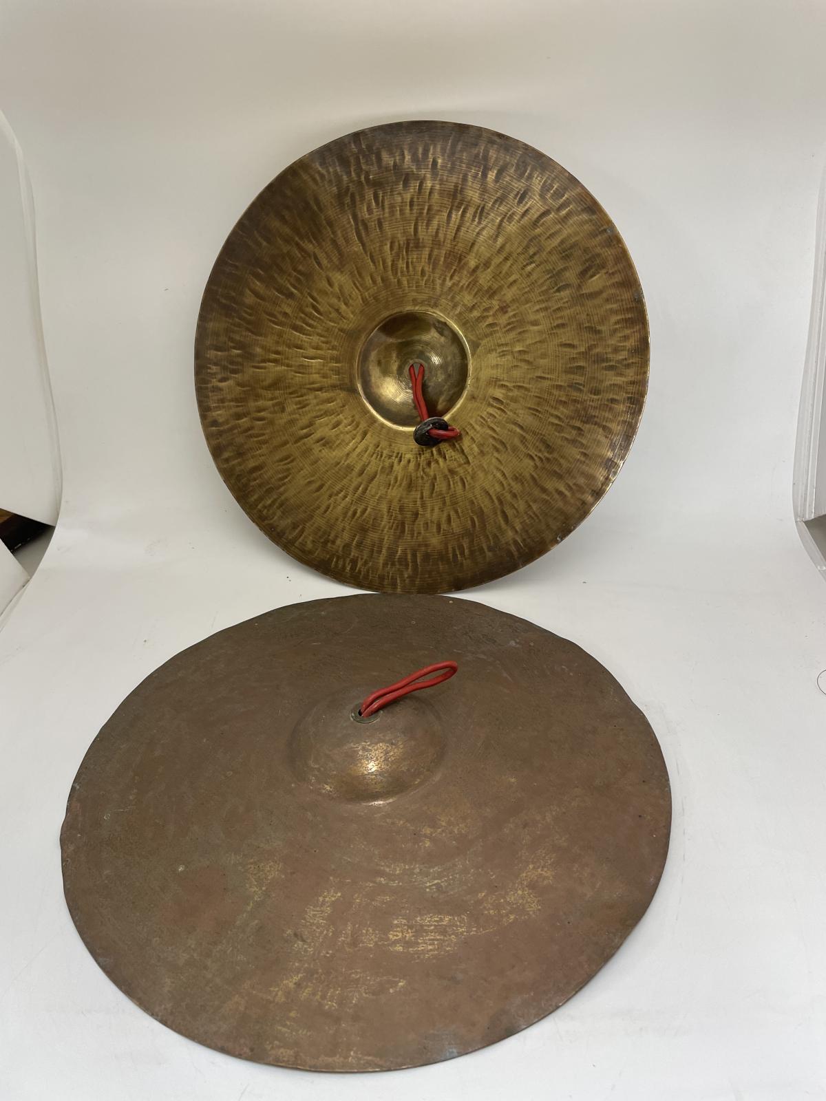 Pair of hand held brass cymbals