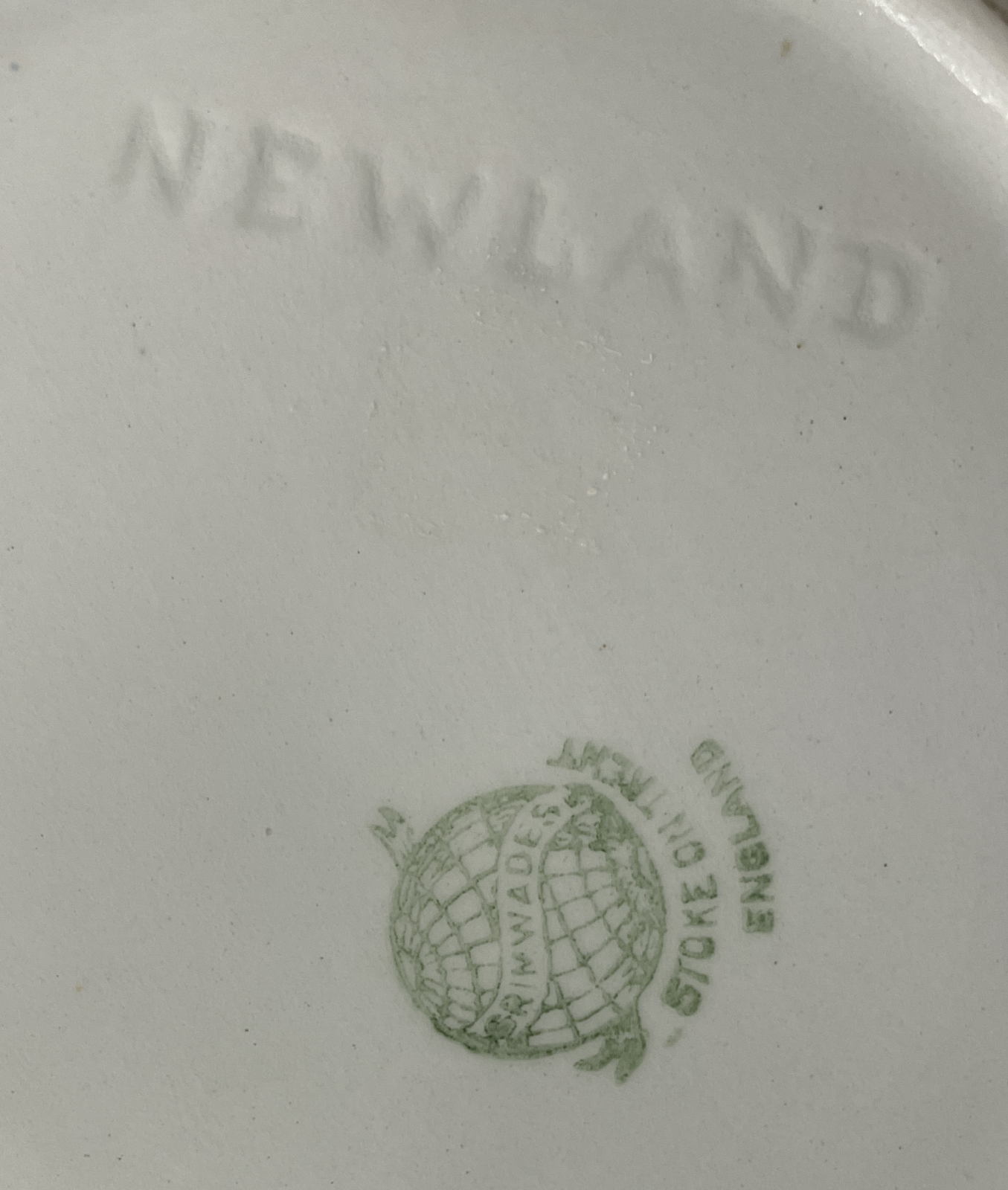 The underside of the jug showing the Grimwades mark and the impressed NEWLAND