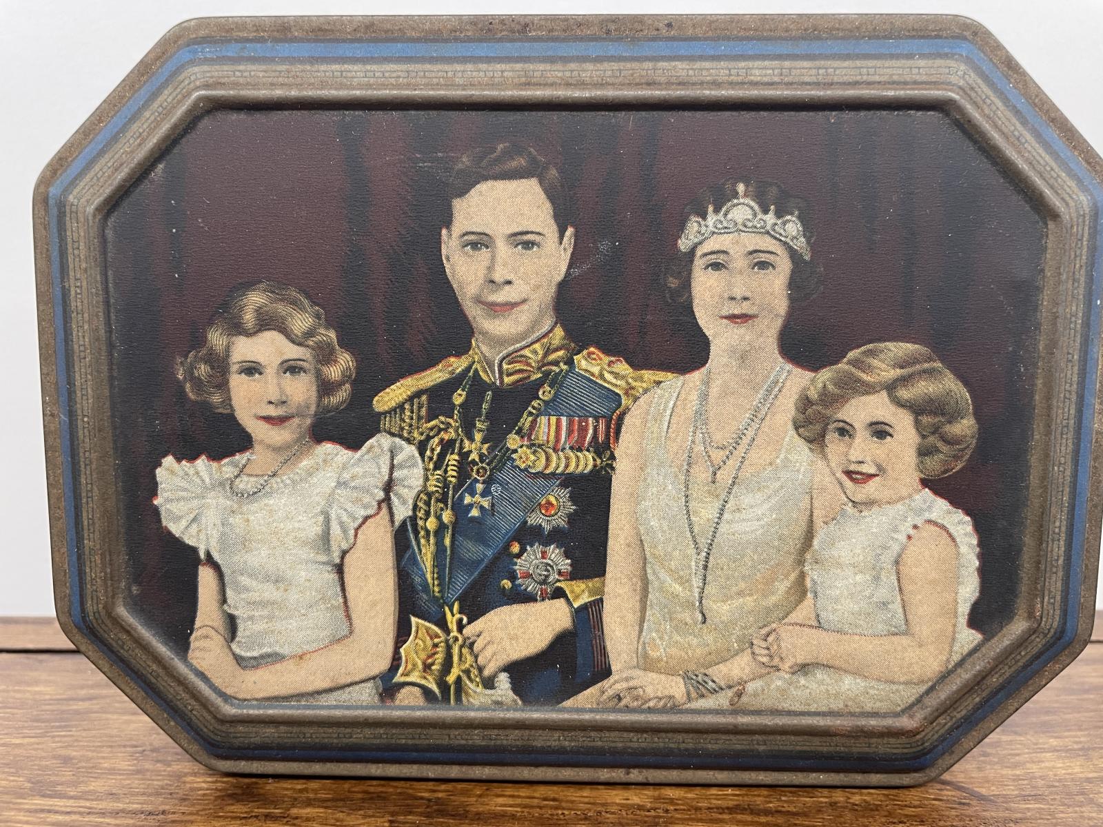 Biscuit tin with a coronation picture of King George VI and his family