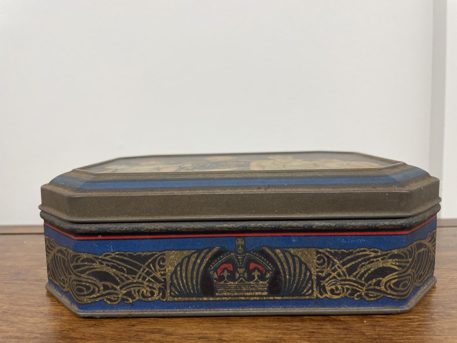 Sides of the King George VI Biscuit tin