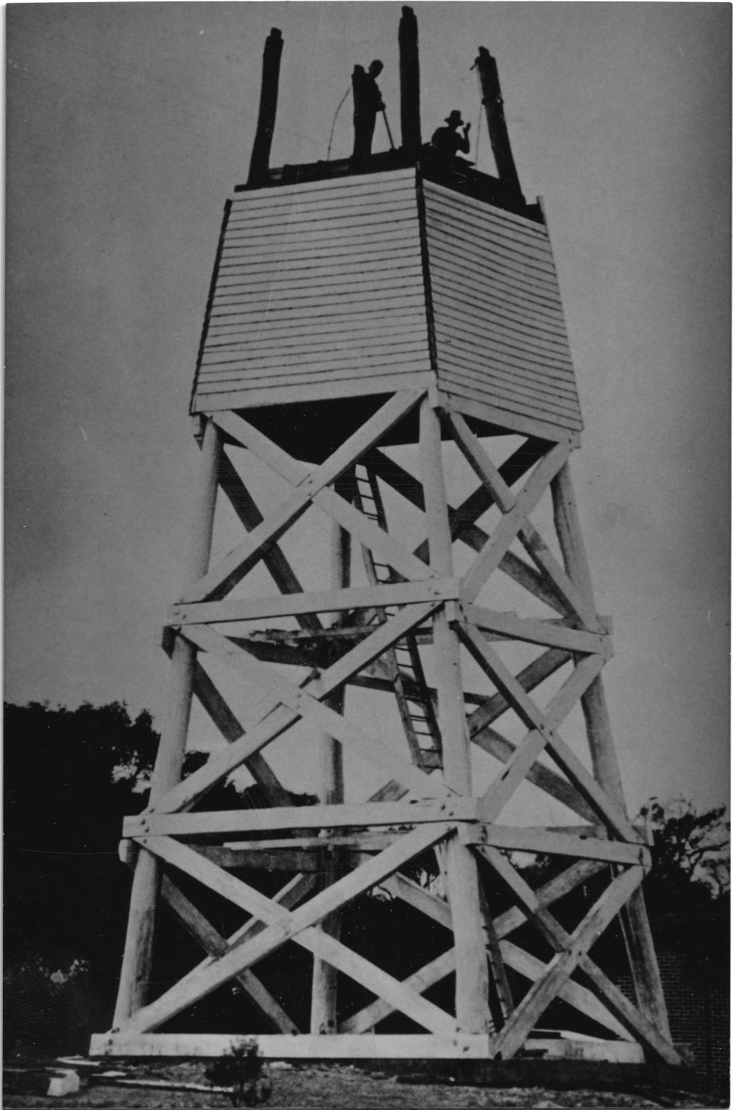 Demolition of the Busselton lighthouse starts on April 7 1933. Stan White and RC Forsyth can be seen working at the top of the lighthouse. Photo 4319 BHS Archive