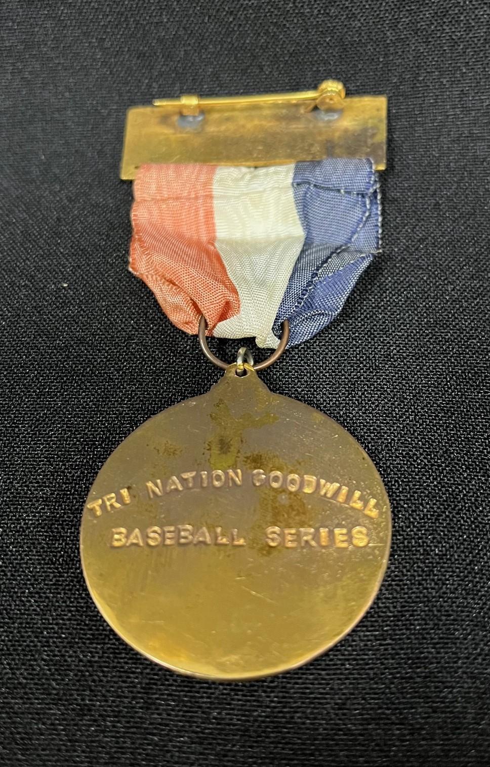 Dale Hughes 1969 Tri-Nations Goodwill Baseball Series medallion (reverse)