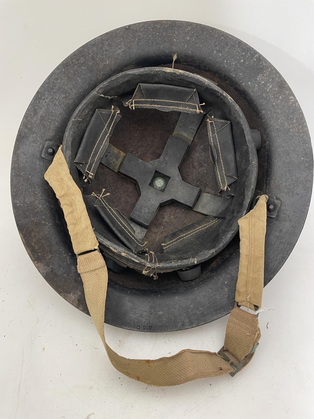 Underside of helmet showing the lining and chin strap