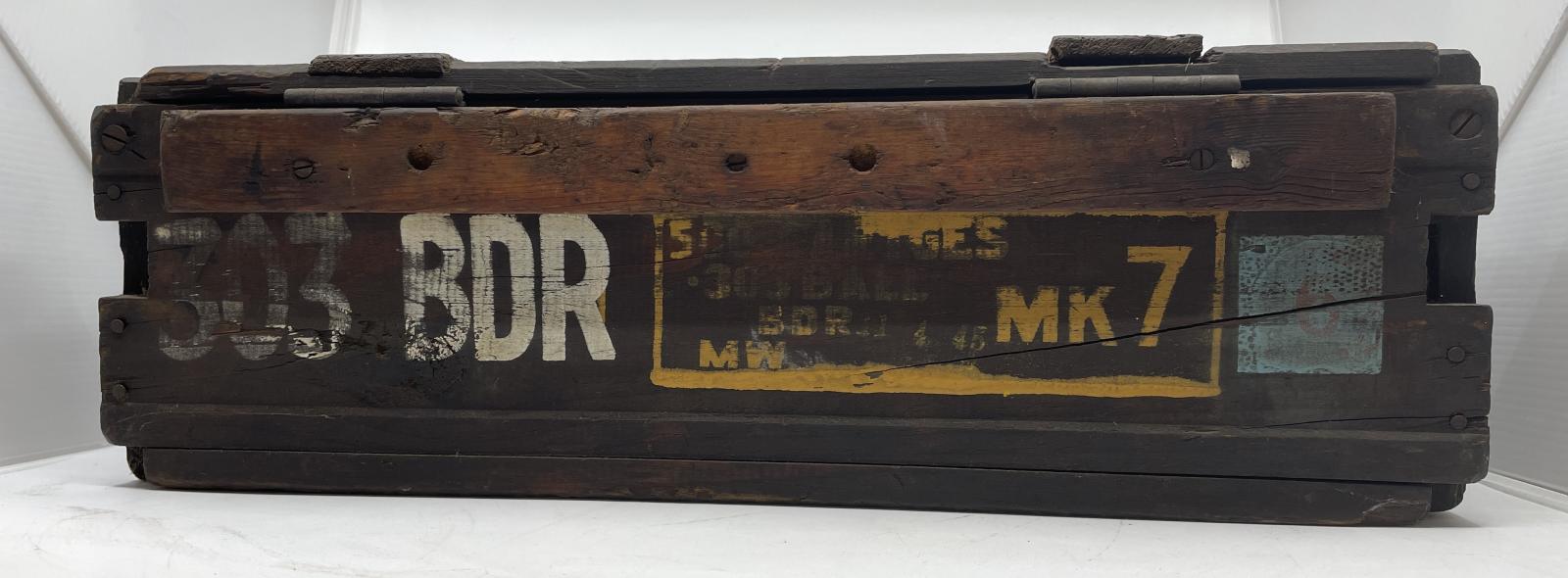 Markings and hinges on the back of the ammunition box