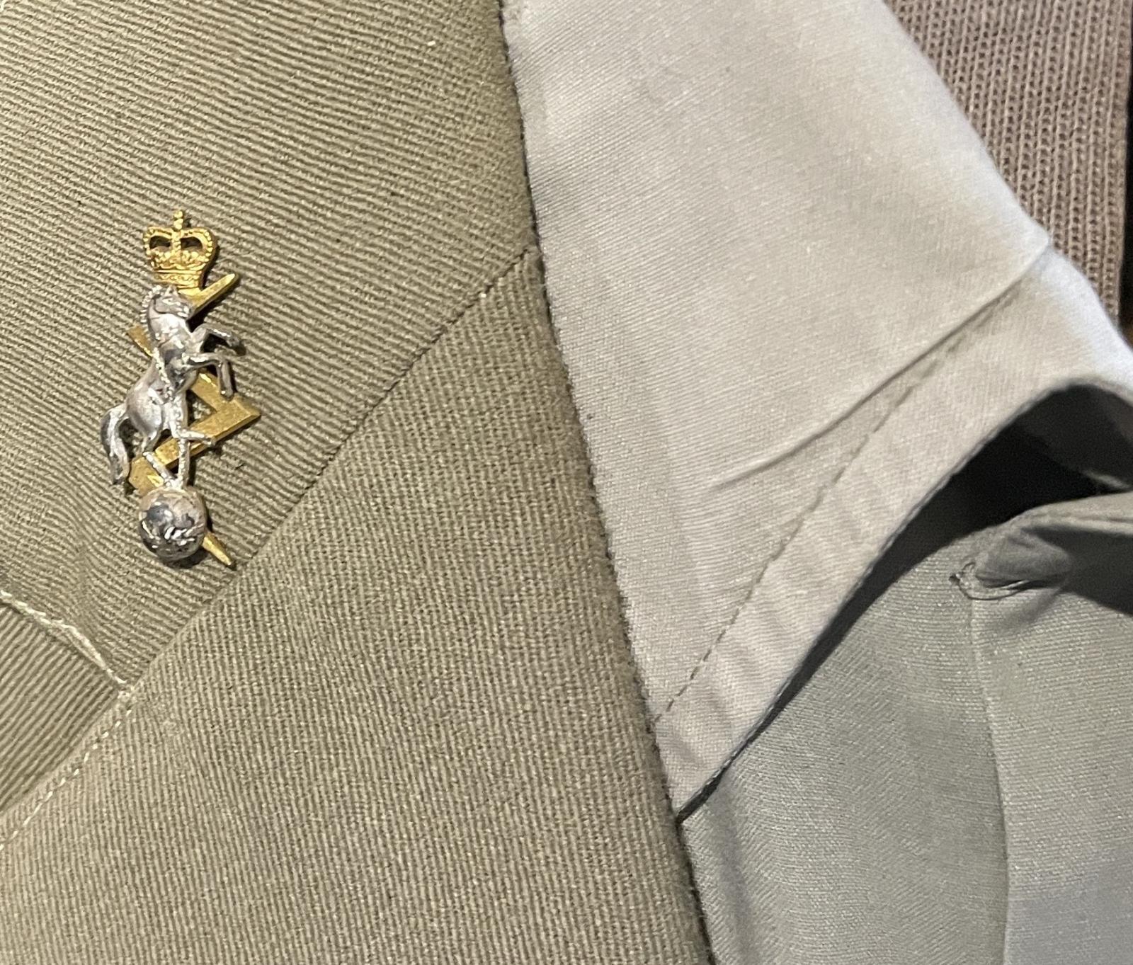 Corp badge pinned to lapel