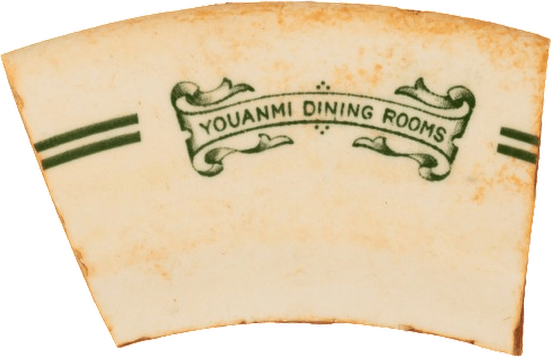 Fragment of crockery with the text 'YOUANMI DINING ROOMS' on it