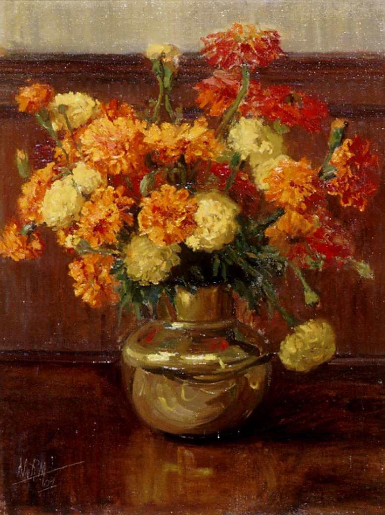 Yellow and orange marigolds in a gold vase 