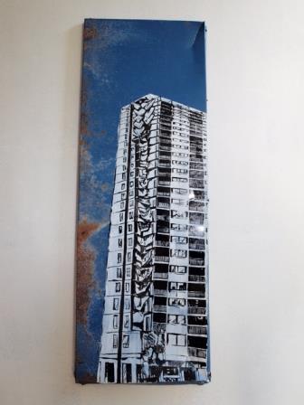 Drawing depicting a blue background and a skyscraper type building in white, grey and black ink to the right of the drawing