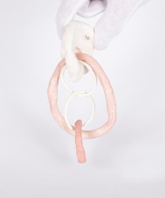 hanging looped rings coloured pale pink and white