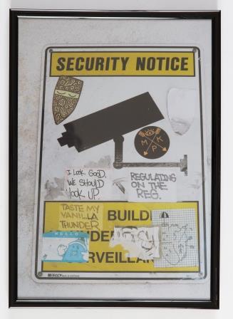 Photo of worn security surveillance notice