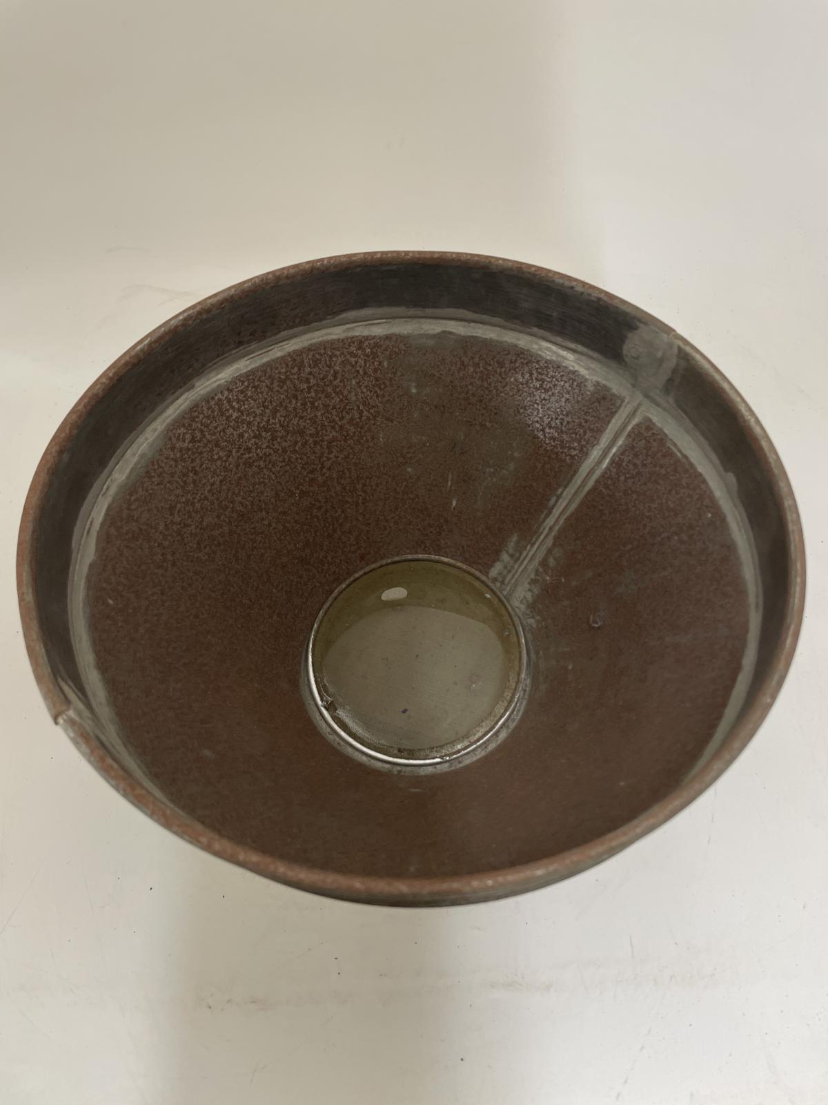 Inside of the strainer showing the filter