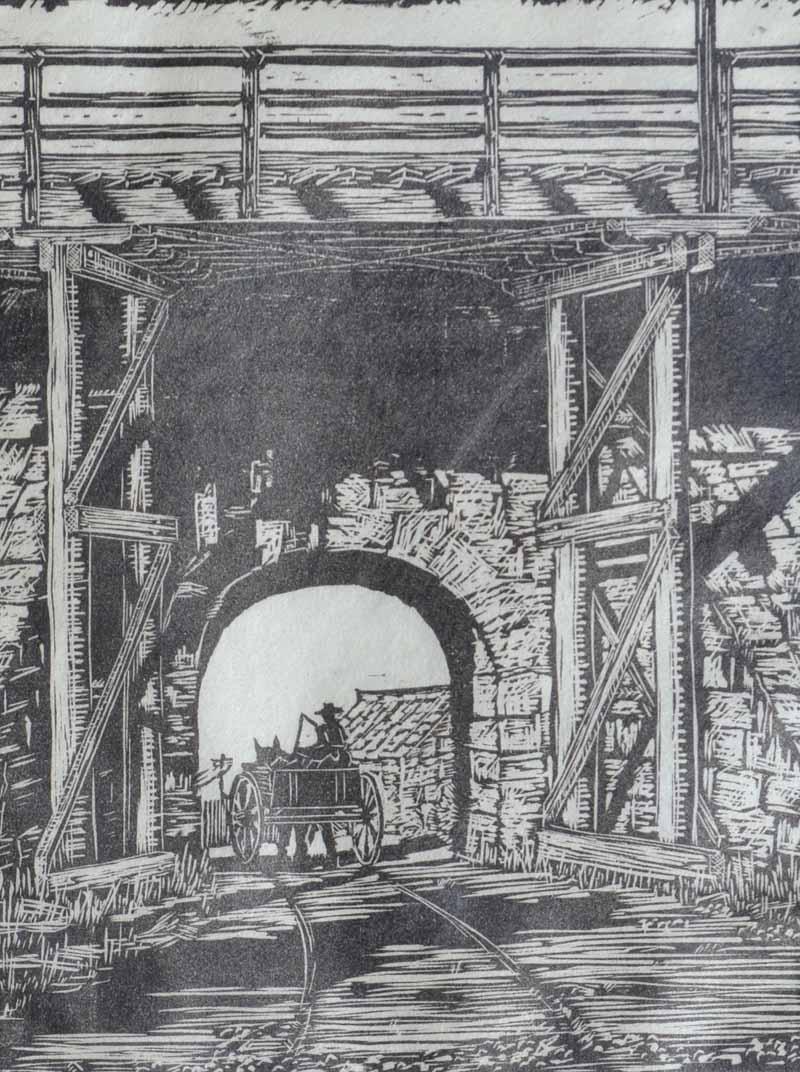 Black and white image depicting Fremantle Bridge Archway. There is a horse and carraige riding through the arch