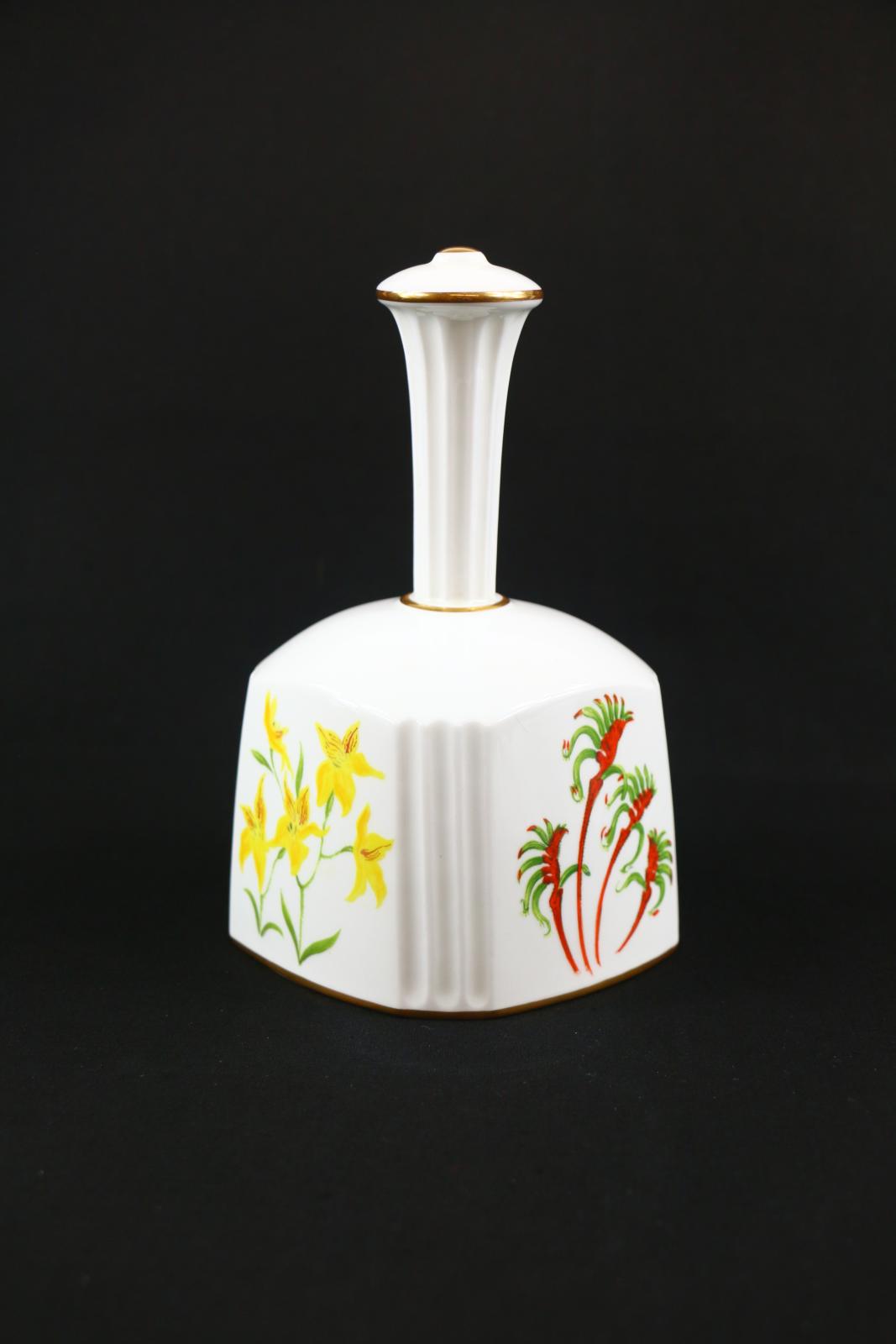 A side view of the bell showing the handpainted Cowslip Orchid and Kangaroo Paw wildflowers.