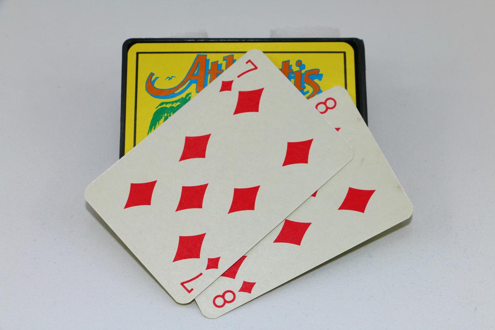 The deck of cards with the top two cards showing the seven and eight of diamonds.