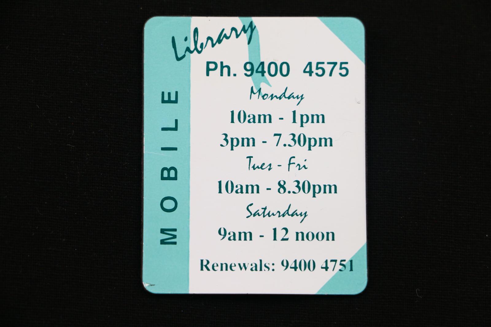 White and blue fridge magnet for Wanneroo Mobile Library with opening times.