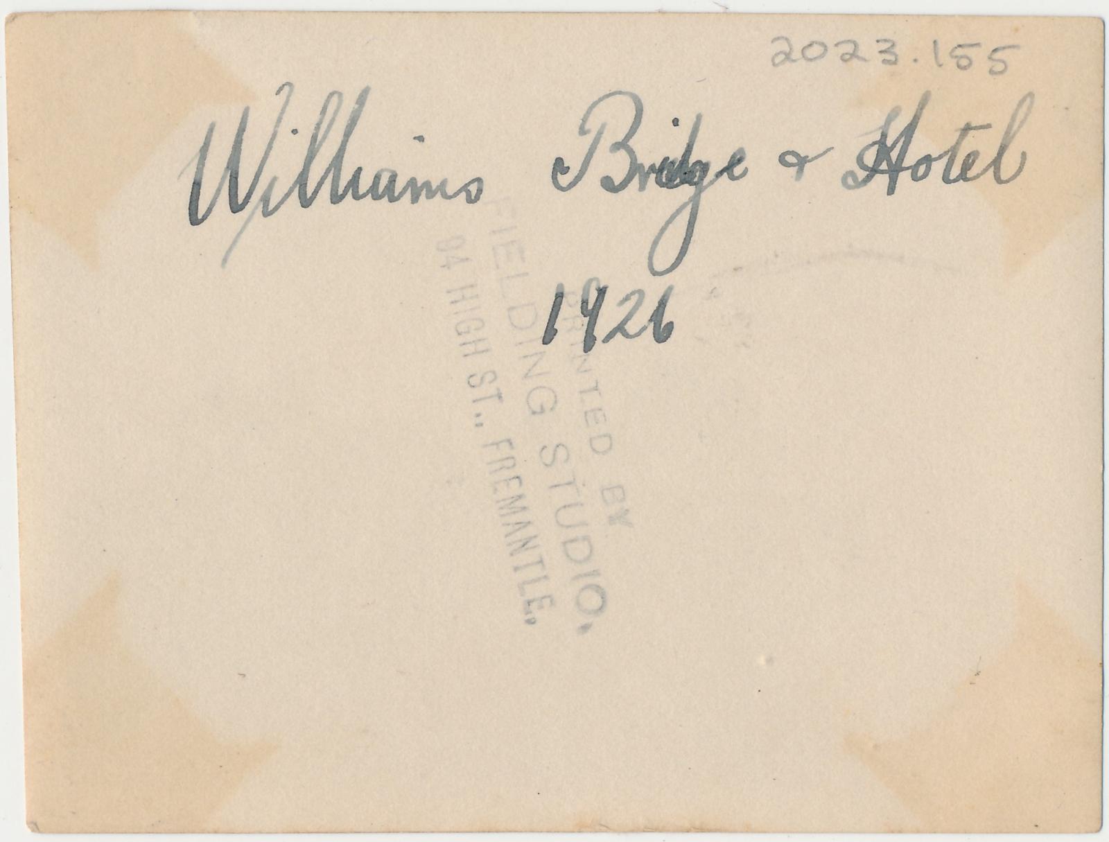 Back of photograph of looking across bridge to Williams Hotel, Williams