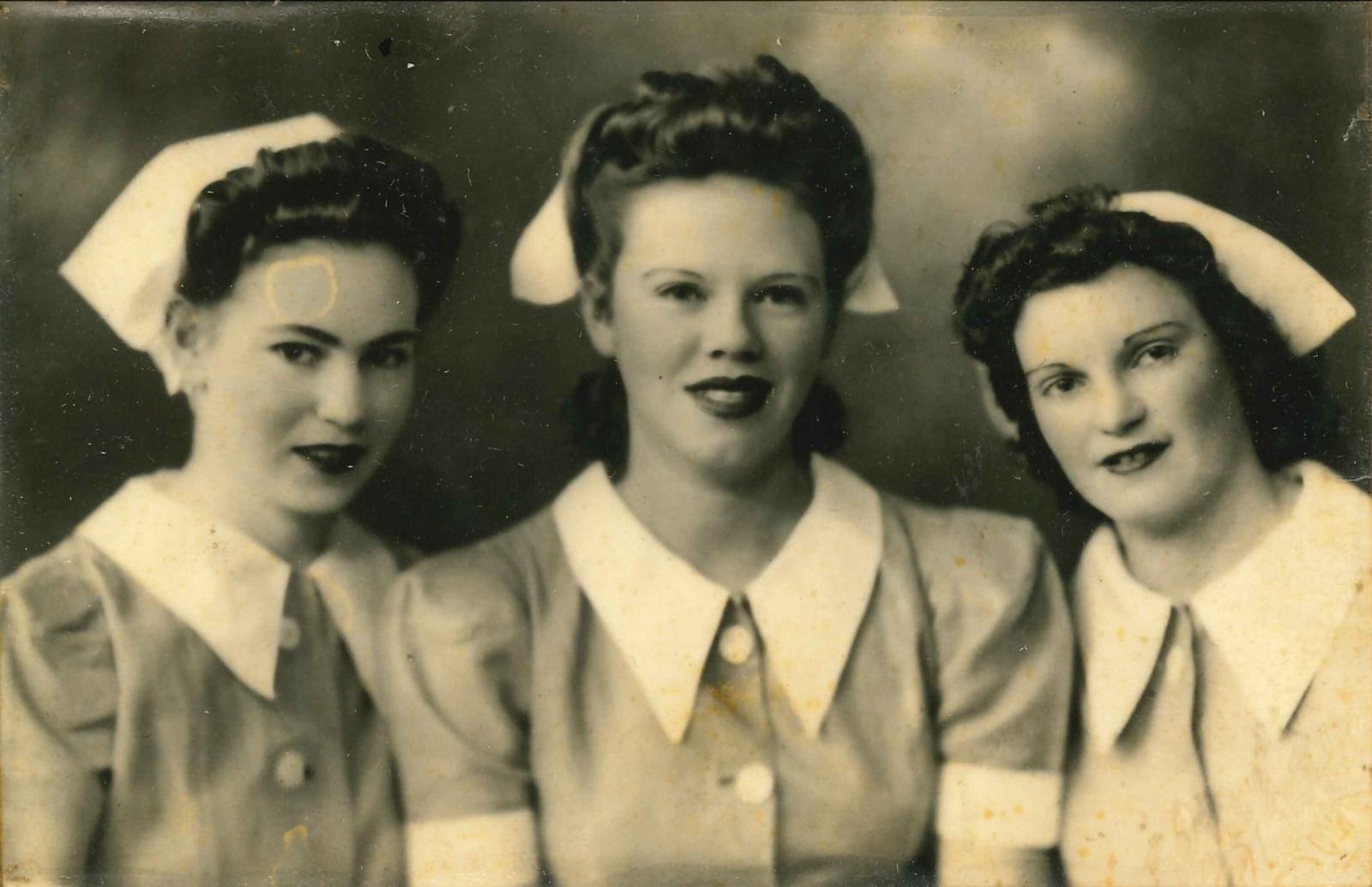 Black and white photograph of three Perth Hospital nurses with Betty Kelly in the centre c1943