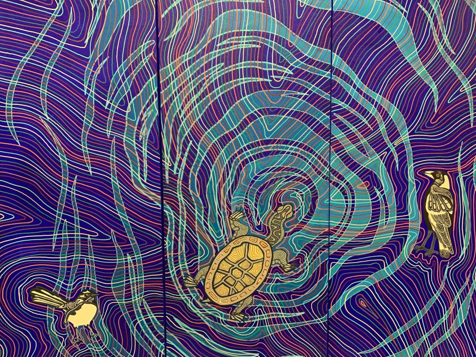 A painting with a blue background with ripple effects and different colours of blue and some red lines, a turtle and two birds look like they are floating on top