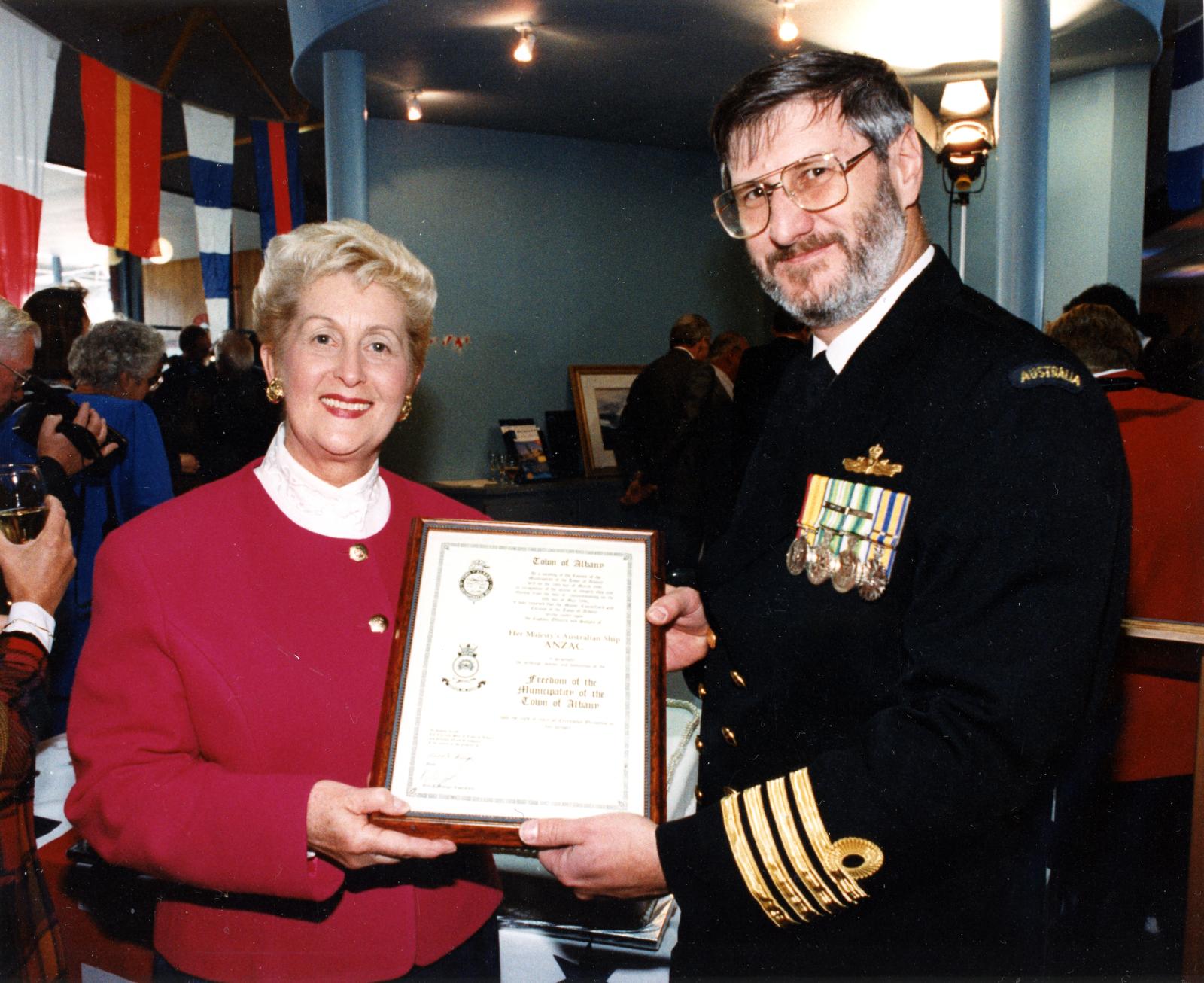 Mayor Annette Knight and Captain Les Pataky with HMAS ANZAC's Freedom of Entry certificate