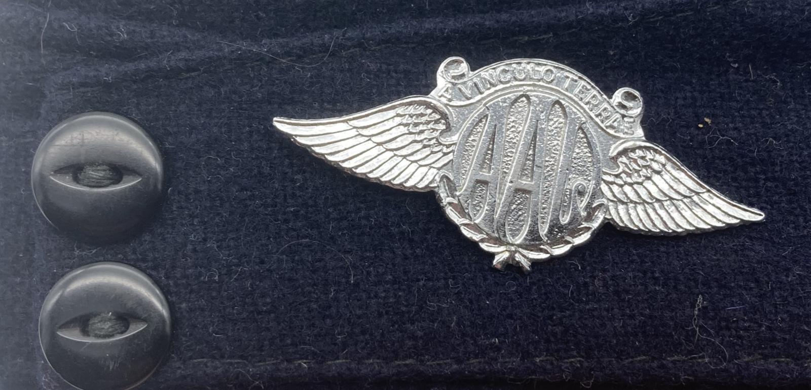 Australian Air League sidecap with metal badge - close-up detail