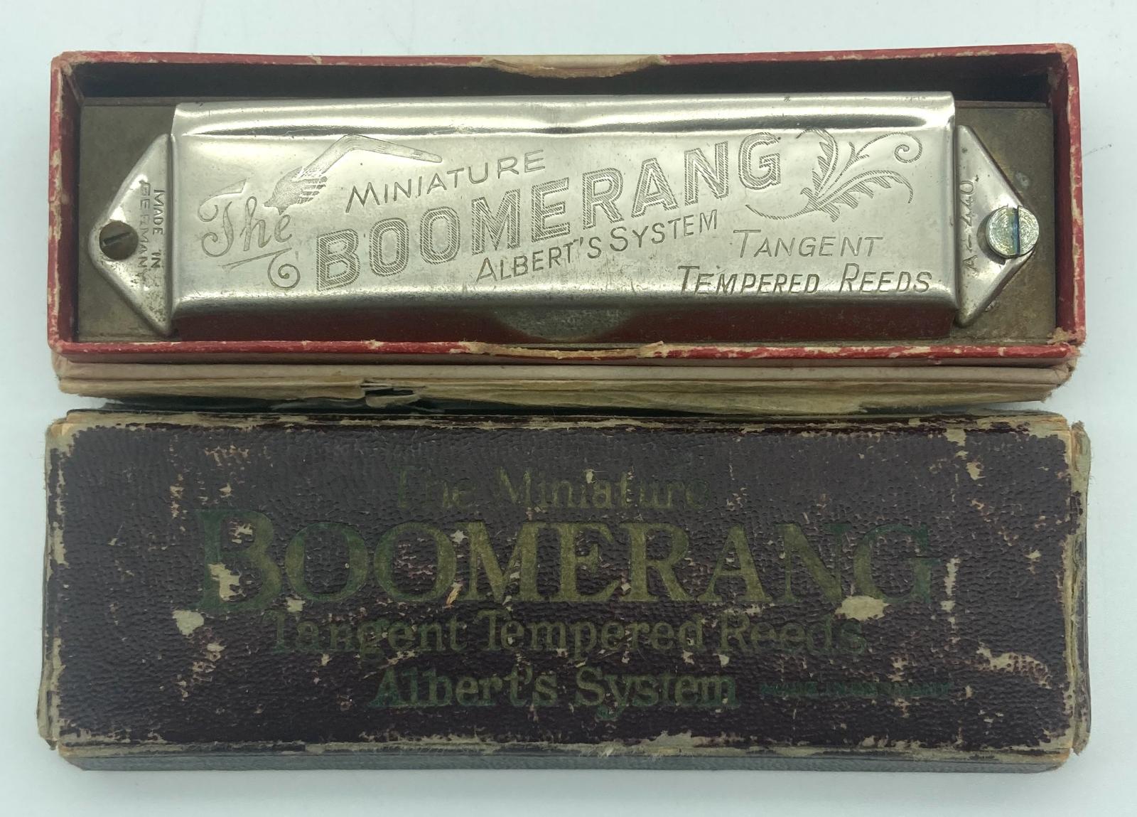 'Boomerang' mouth organ inside box