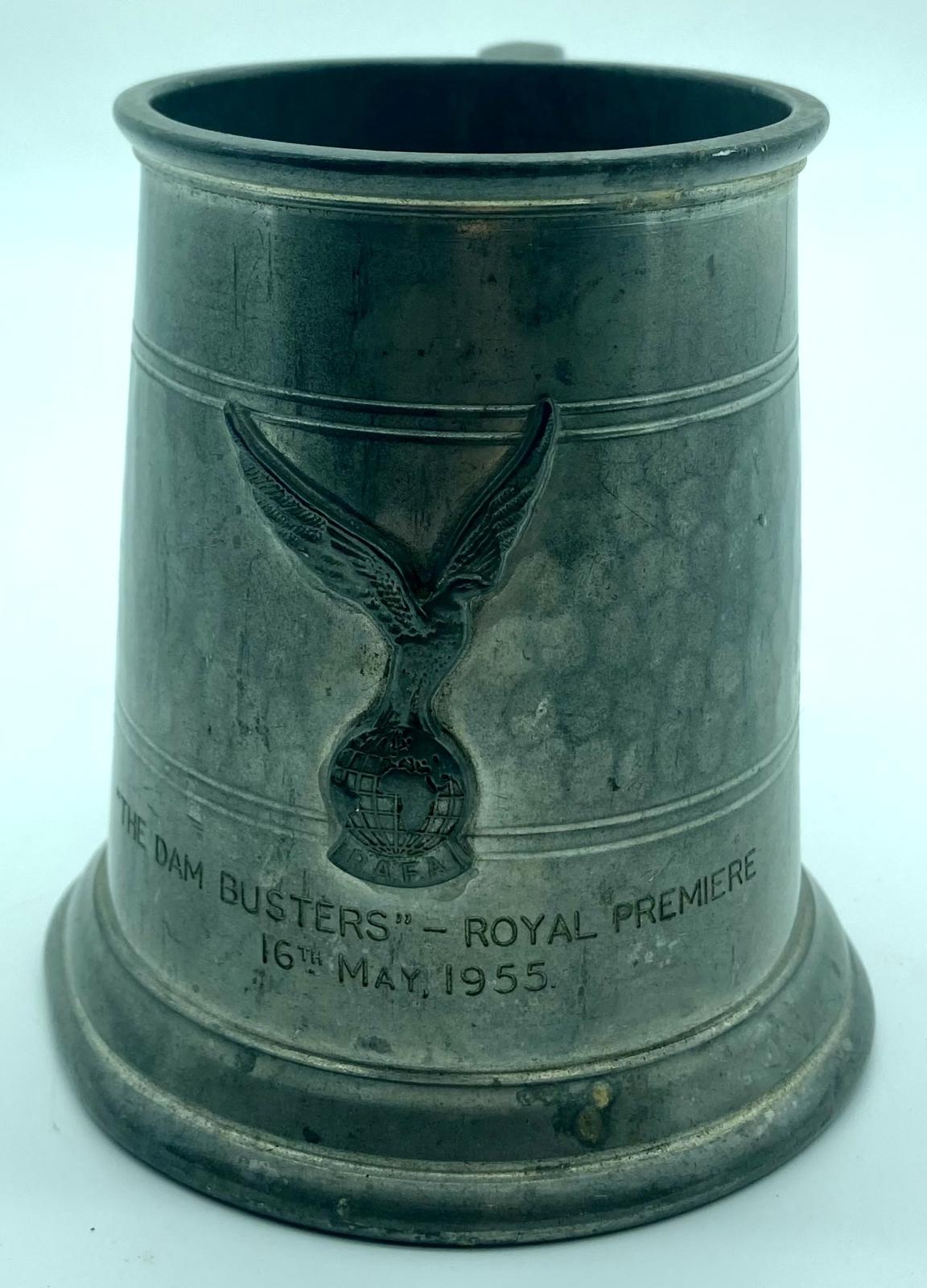 Metal tankard showing motif and inscription